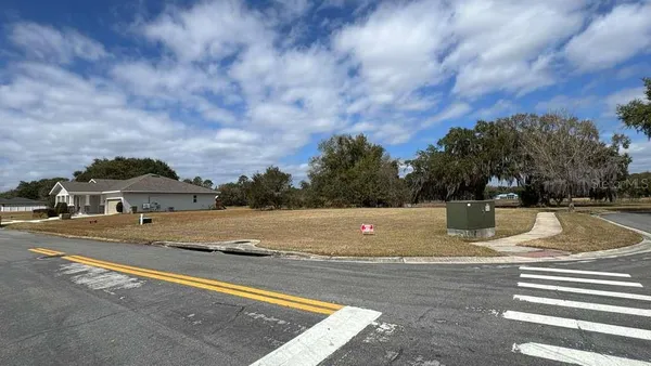 a view of a swimming pool with a yard