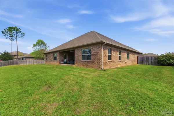 a front view of house with yard and green space