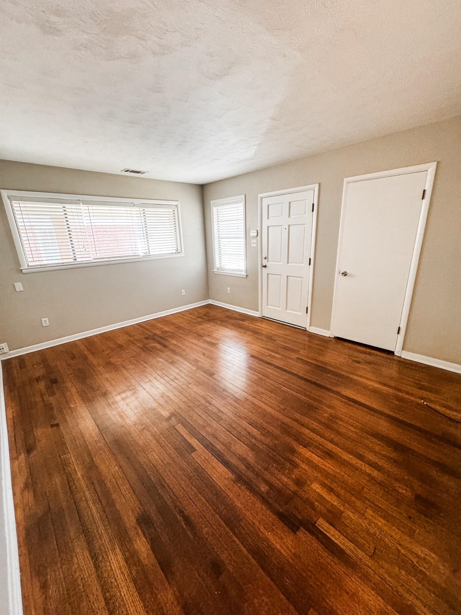 296 North Yates Road Memphis, TN 38120 - Photo 4 of 7 wooden floor in an empty room with a window