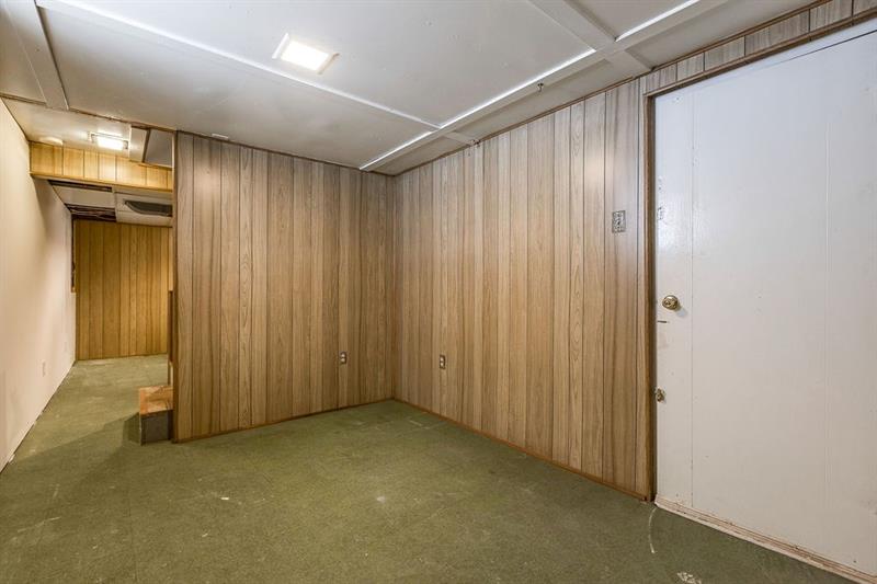 4212 Millington Road Pittsburgh, PA 15217 - Photo 22 of 25 Additional basement room with wine room, storage and entrance to the garage