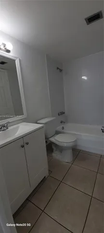 a bathroom with a toilet and a sink