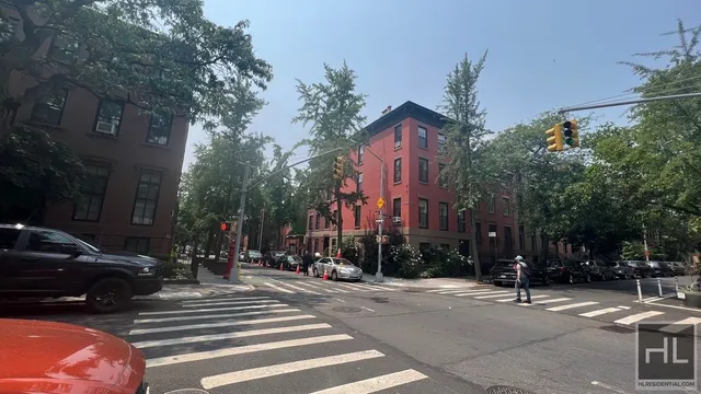 a view of a building with car parked