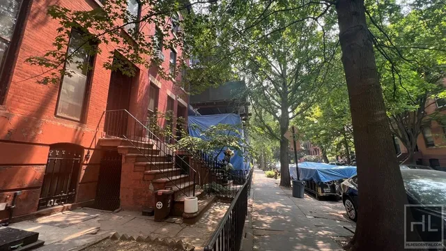 a view of a patio with couches and potted plants