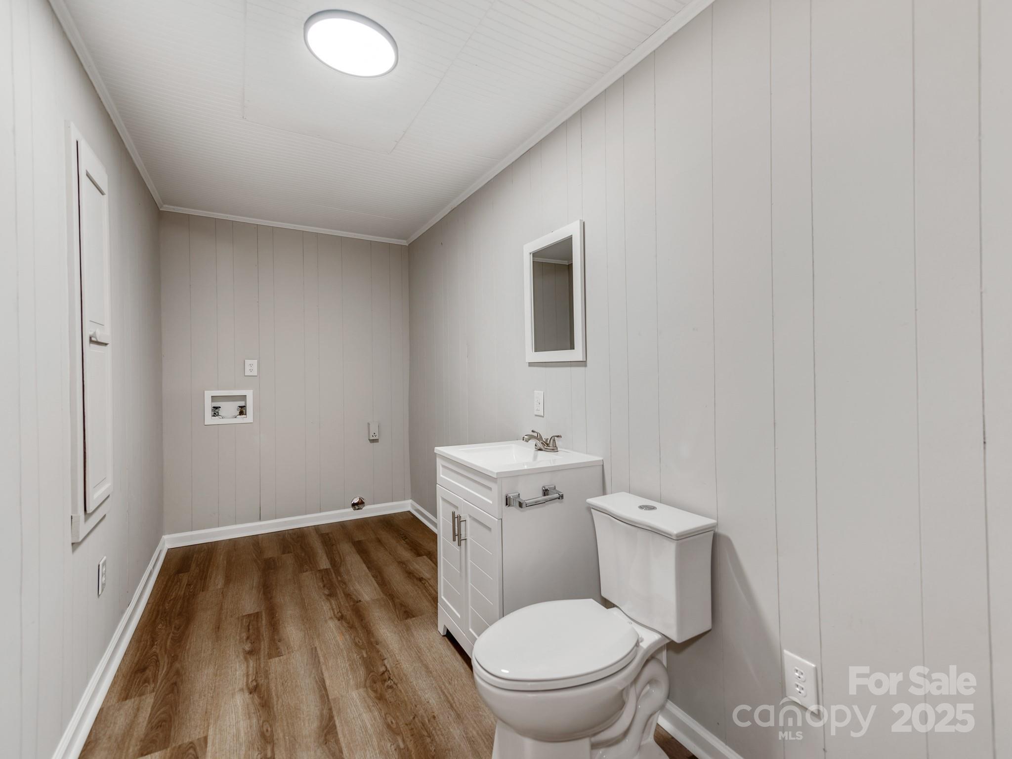 107 Rutledge Road Mount Holly, NC 28120 - Photo 13 of 26 a white toilet sitting next to a bathroom sink