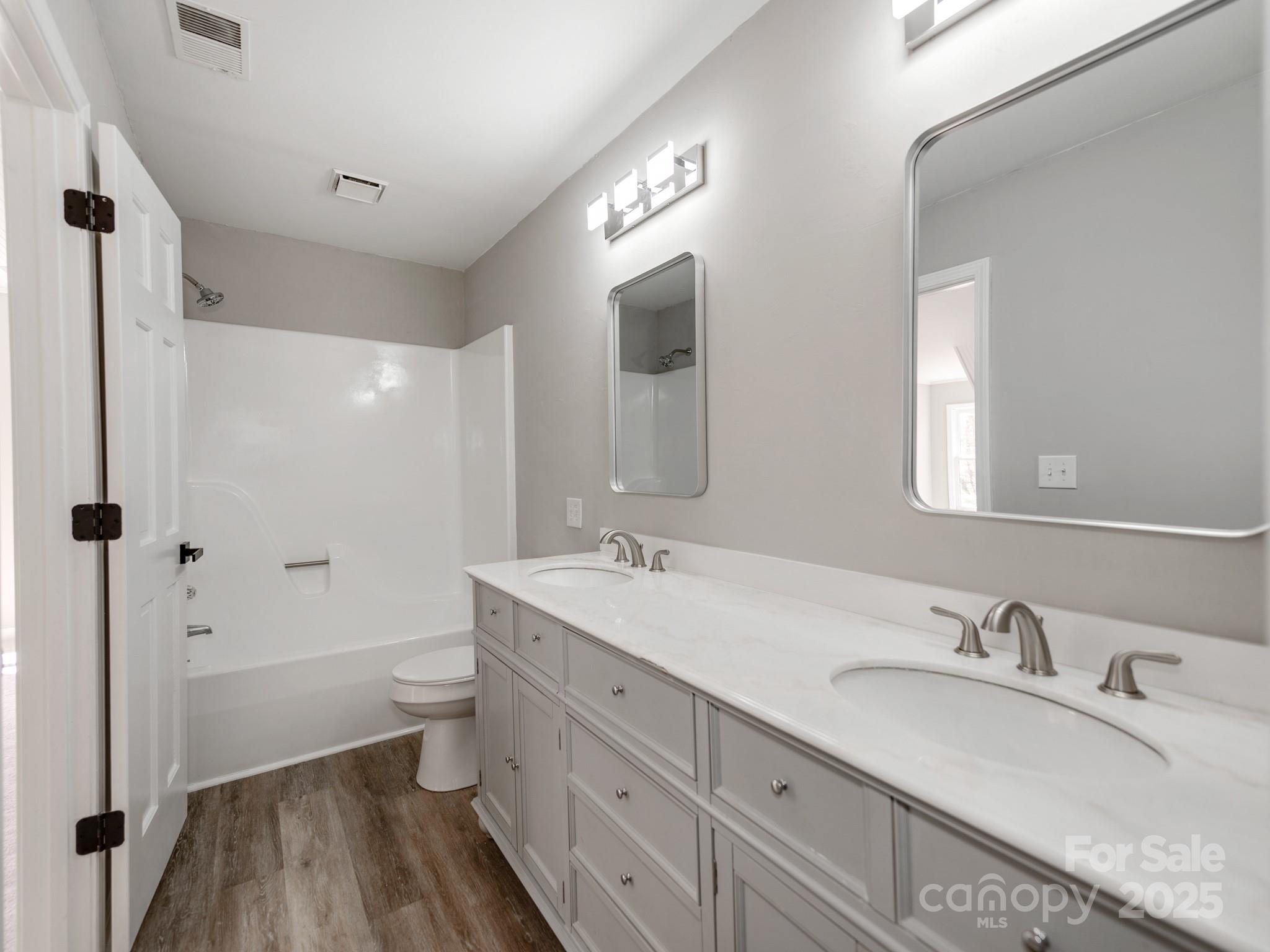 107 Rutledge Road Mount Holly, NC 28120 - Photo 20 of 26 a bathroom with a granite countertop sink toilet and shower