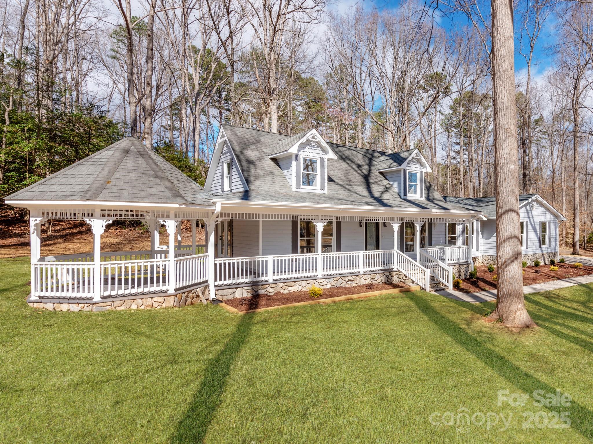 107 Rutledge Road Mount Holly, NC 28120 - Photo 2 of 26 a front view of a house with a garden and deck