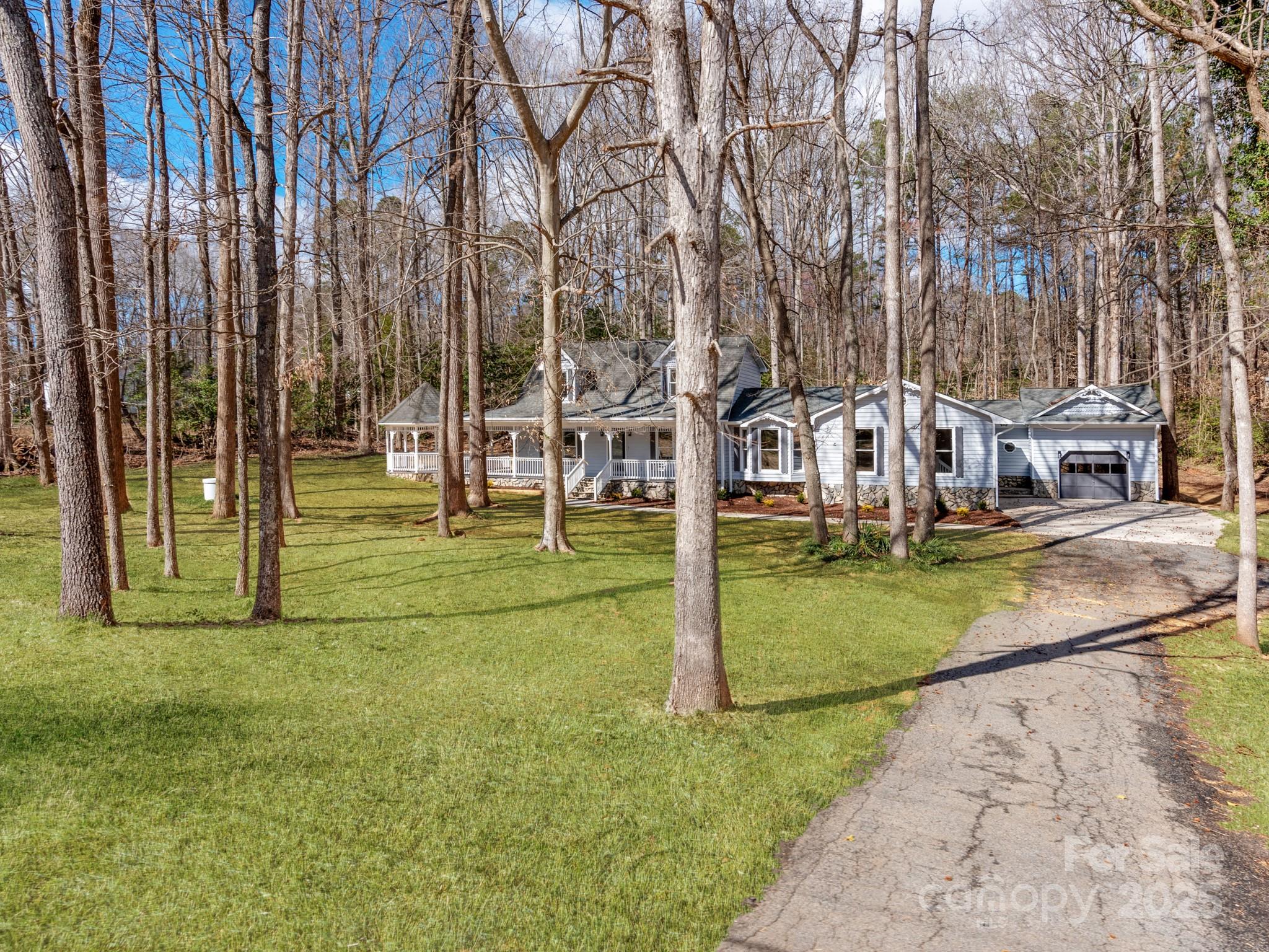 107 Rutledge Road Mount Holly, NC 28120 - Photo 3 of 26 a view of a park with swings