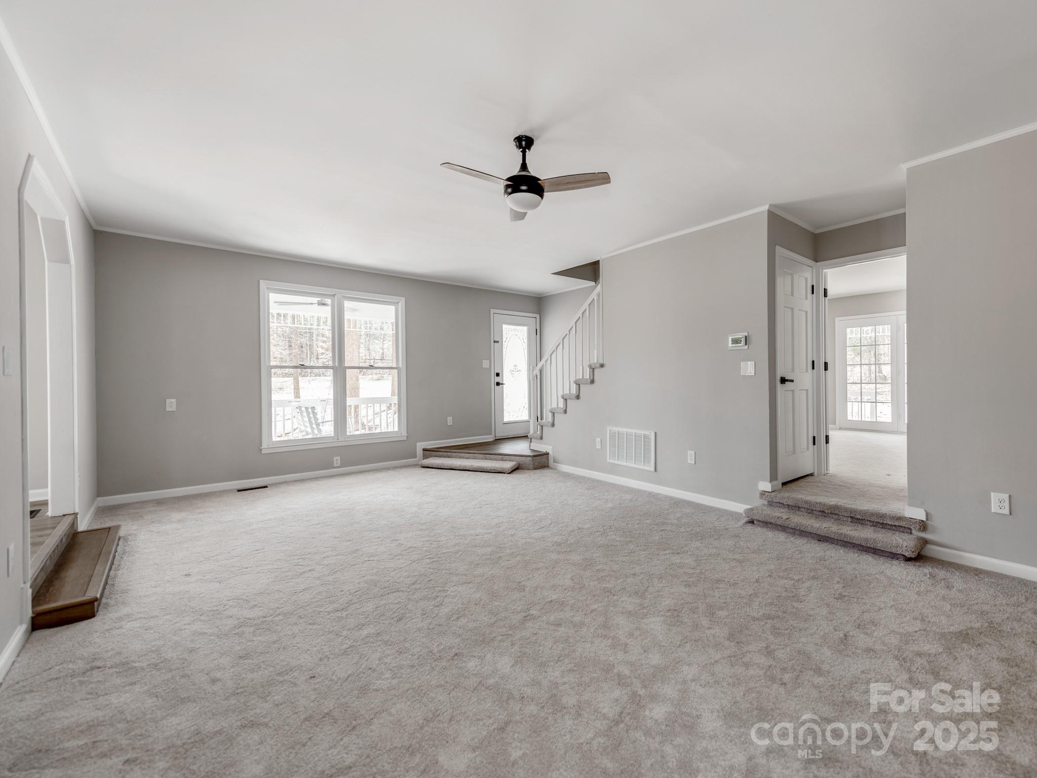107 Rutledge Road Mount Holly, NC 28120 - Photo 6 of 26 an empty room with windows and ceiling fan
