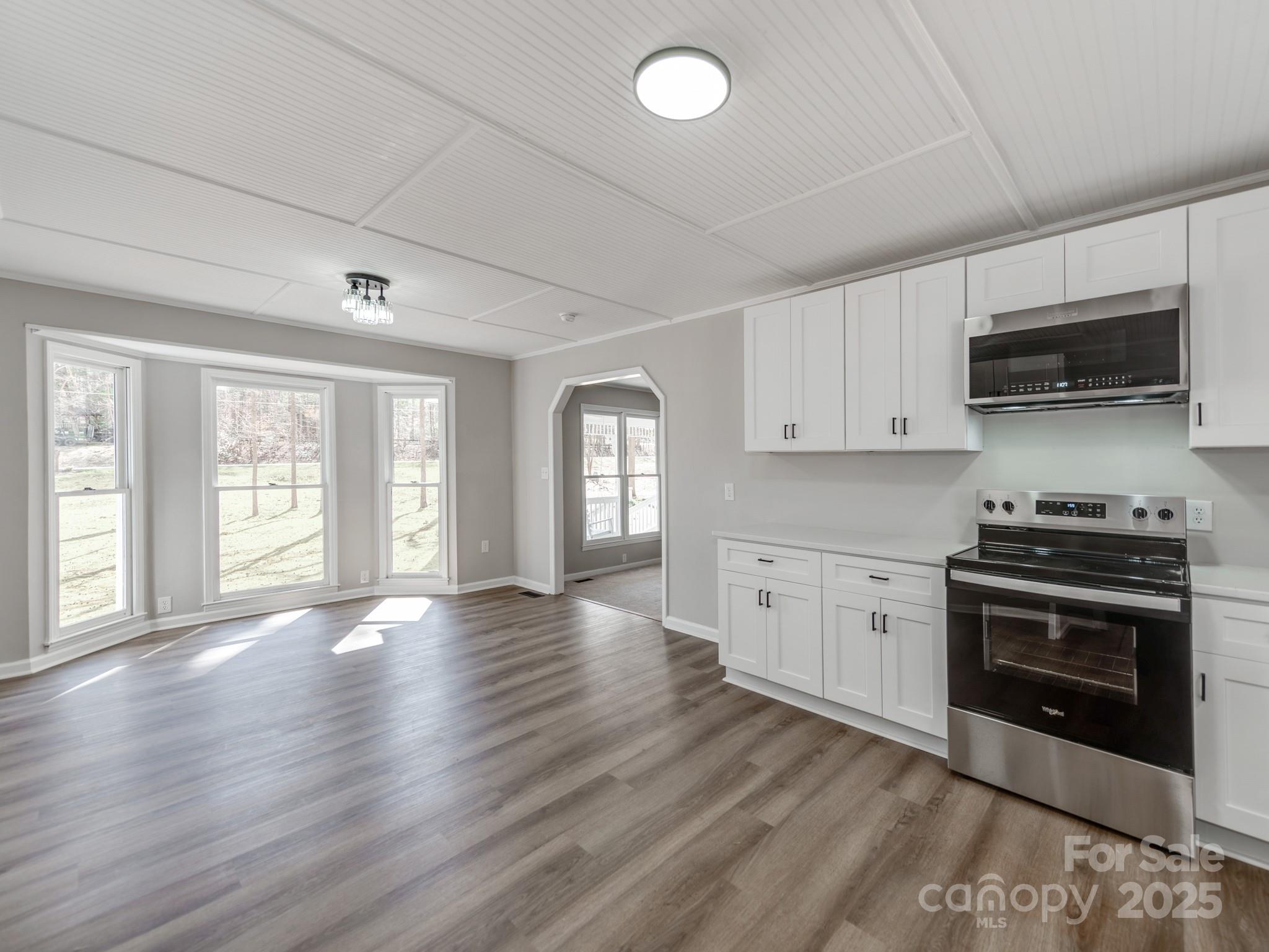 107 Rutledge Road Mount Holly, NC 28120 - Photo 9 of 26 a kitchen with stainless steel appliances granite countertop a stove and a sink