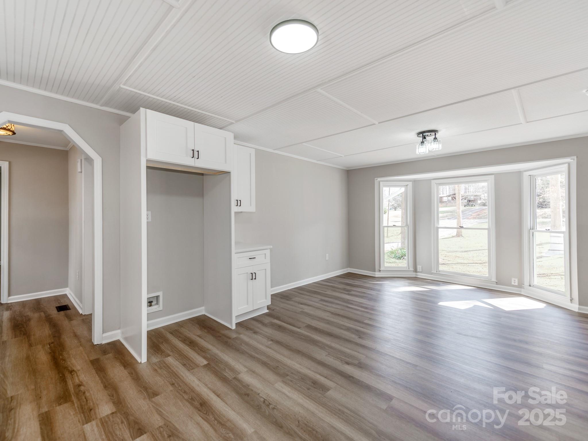 107 Rutledge Road Mount Holly, NC 28120 - Photo 10 of 26 a view of an empty room with wooden floor and a window