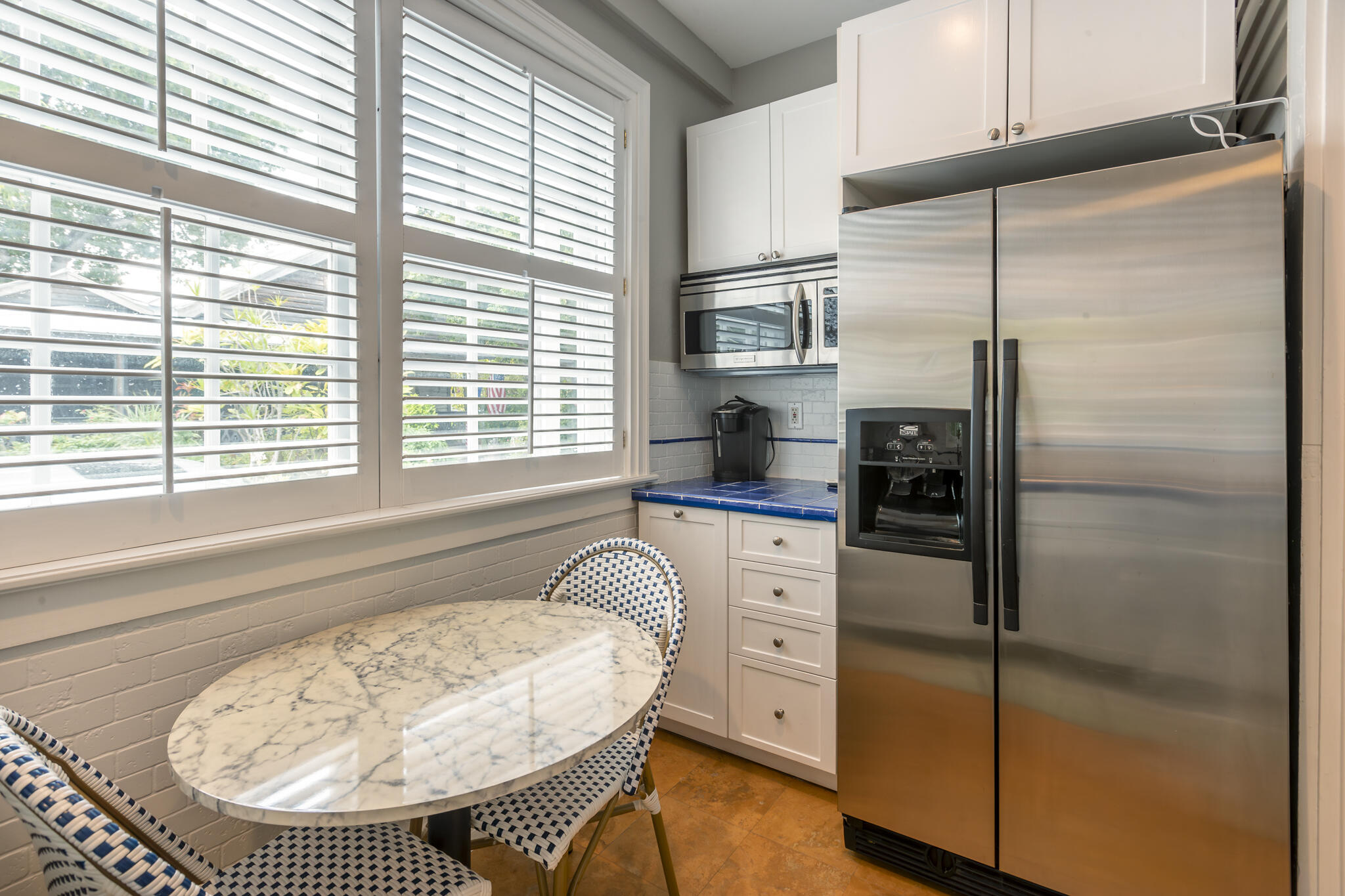 815 Pearl Street, Unit 2 Key West, FL 33040 - Photo 12 of 27 a kitchen with a refrigerator a sink and a window