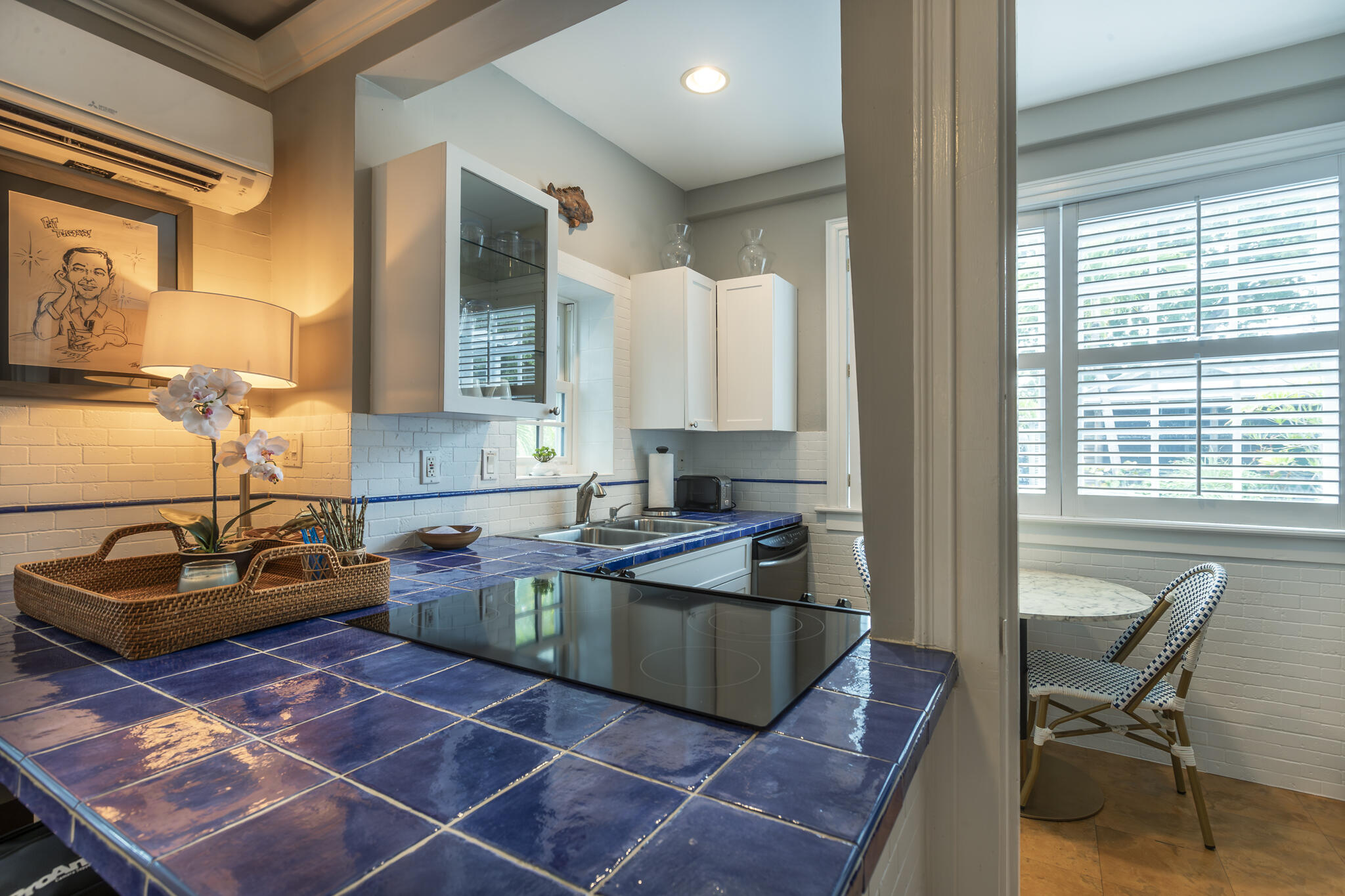 815 Pearl Street, Unit 2 Key West, FL 33040 - Photo 16 of 27 a kitchen with a sink and a stove top oven