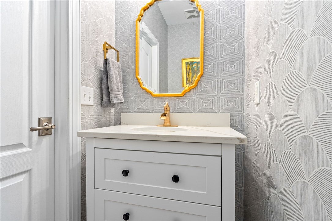 1657 Abby Road Auburn, AL 36830 - Photo 15 of 39 This sleek bathroom features elegant fixtures and a sophisticated vanity.