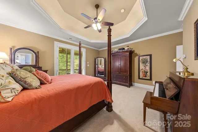 a bedroom with a bed a couch and dresser