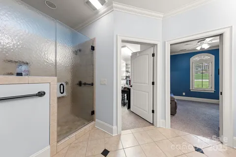 a view of a bathroom with a shower and a sink