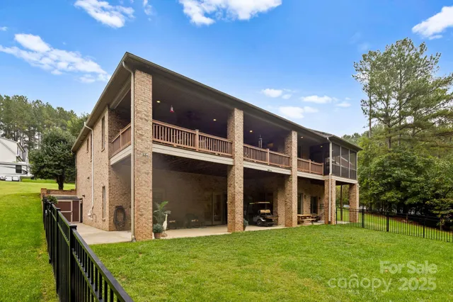 a view of a house with a yard and balcony