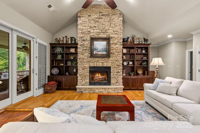 a living room with furniture a rug and a fireplace
