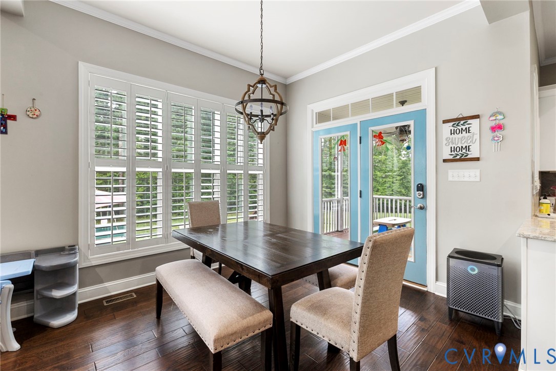16507 Hannington Drive Midlothian, VA 23112 - Photo 13 of 43 a view of a dining room with furniture window and wooden floor