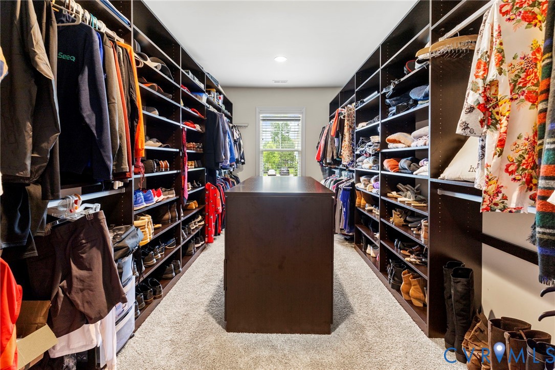 16507 Hannington Drive Midlothian, VA 23112 - Photo 23 of 43 a view of walk in closet with clothes and shoes