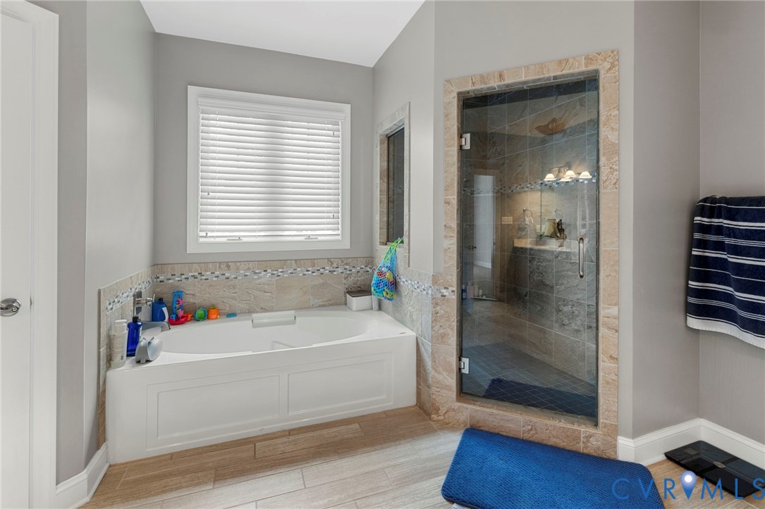 16507 Hannington Drive Midlothian, VA 23112 - Photo 25 of 43 a bathroom with a bathtub and a shower