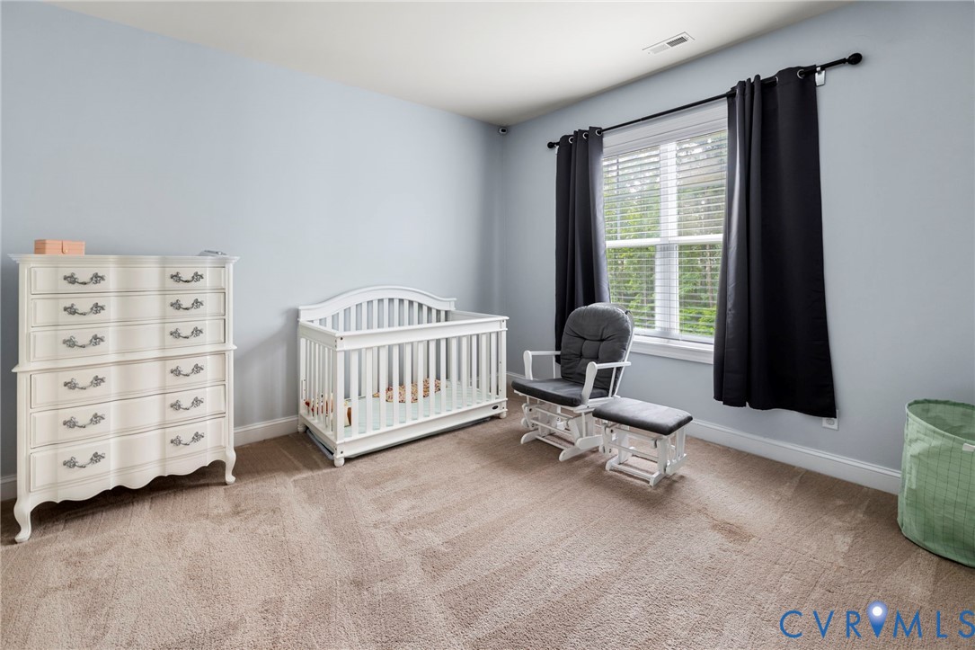 16507 Hannington Drive Midlothian, VA 23112 - Photo 30 of 43 a bedroom with furniture and a window