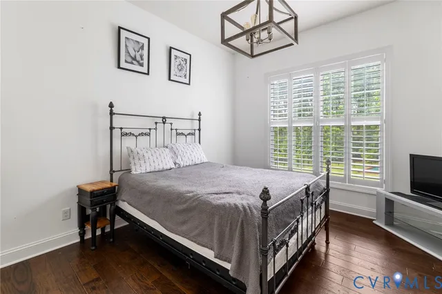 a bed sitting in a room next to a window
