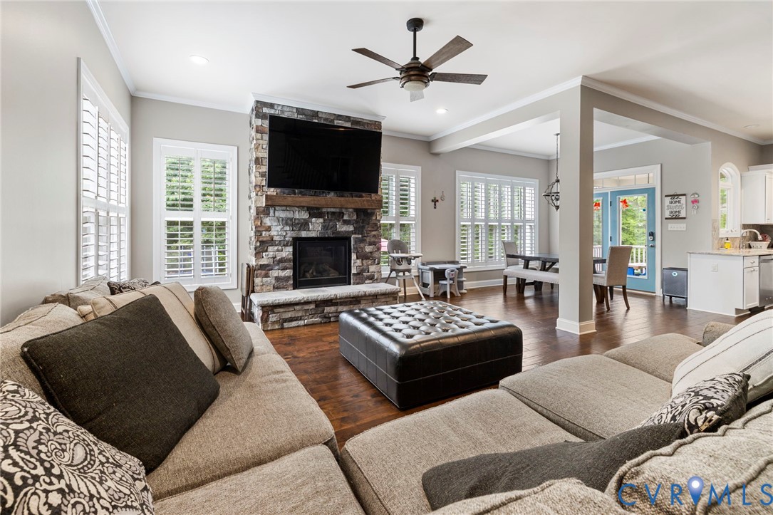 16507 Hannington Drive Midlothian, VA 23112 - Photo 10 of 43 a living room with furniture a flat screen tv and a large window