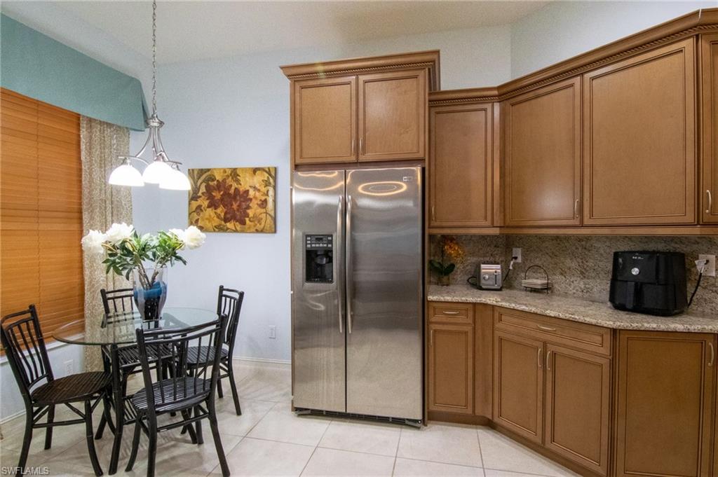 7507 Moorgate Point Way Naples, FL 34113 - Photo 8 of 28 kitchen