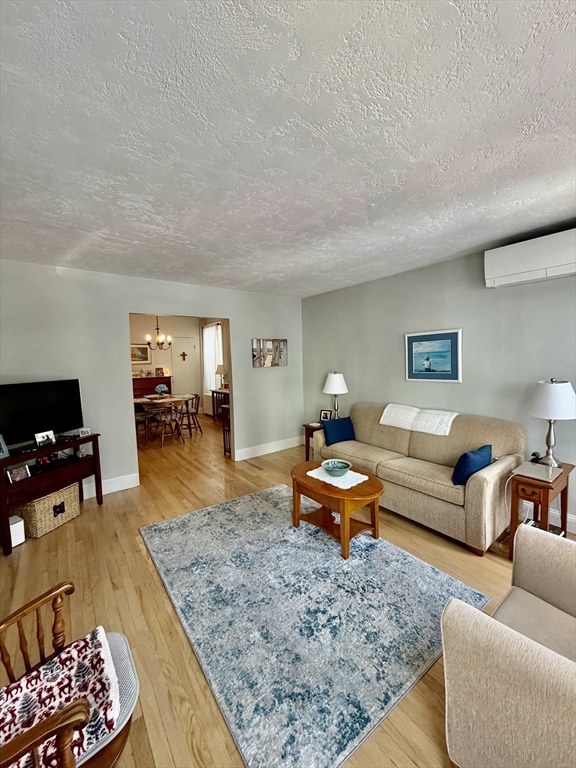 176 M Street, Unit 1 Boston, MA 02127 - Photo 6 of 11 a living room with furniture and wooden floor