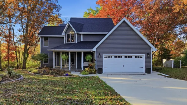front view of a house with a yard