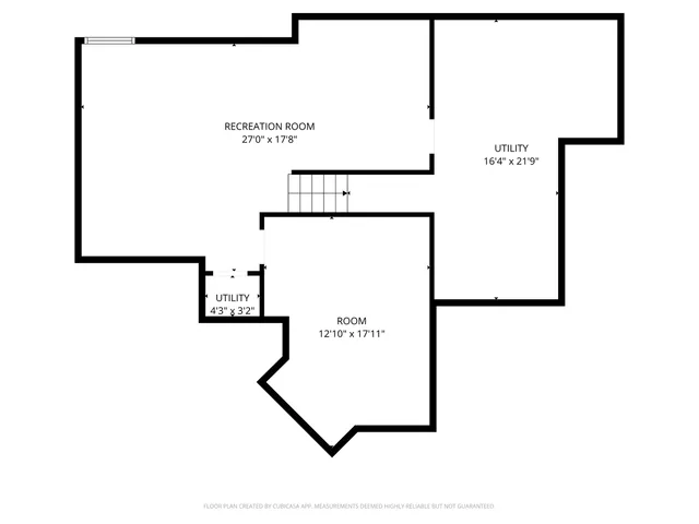 a view of a hallway with wooden floor and a chandelier