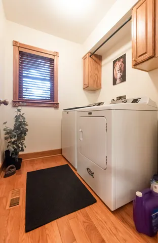a view of a kitchen with stainless steel appliances granite countertop a stove and a sink