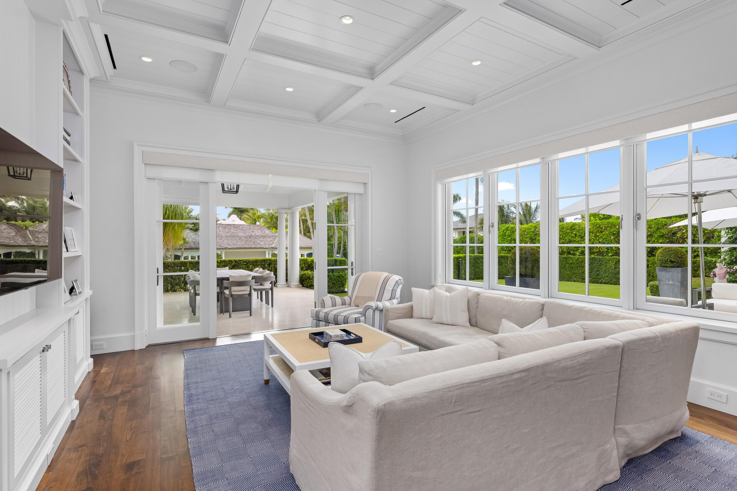 102 Reef Road Palm Beach, FL 33480 - Photo 11 of 22 a living room with furniture and a flat screen tv