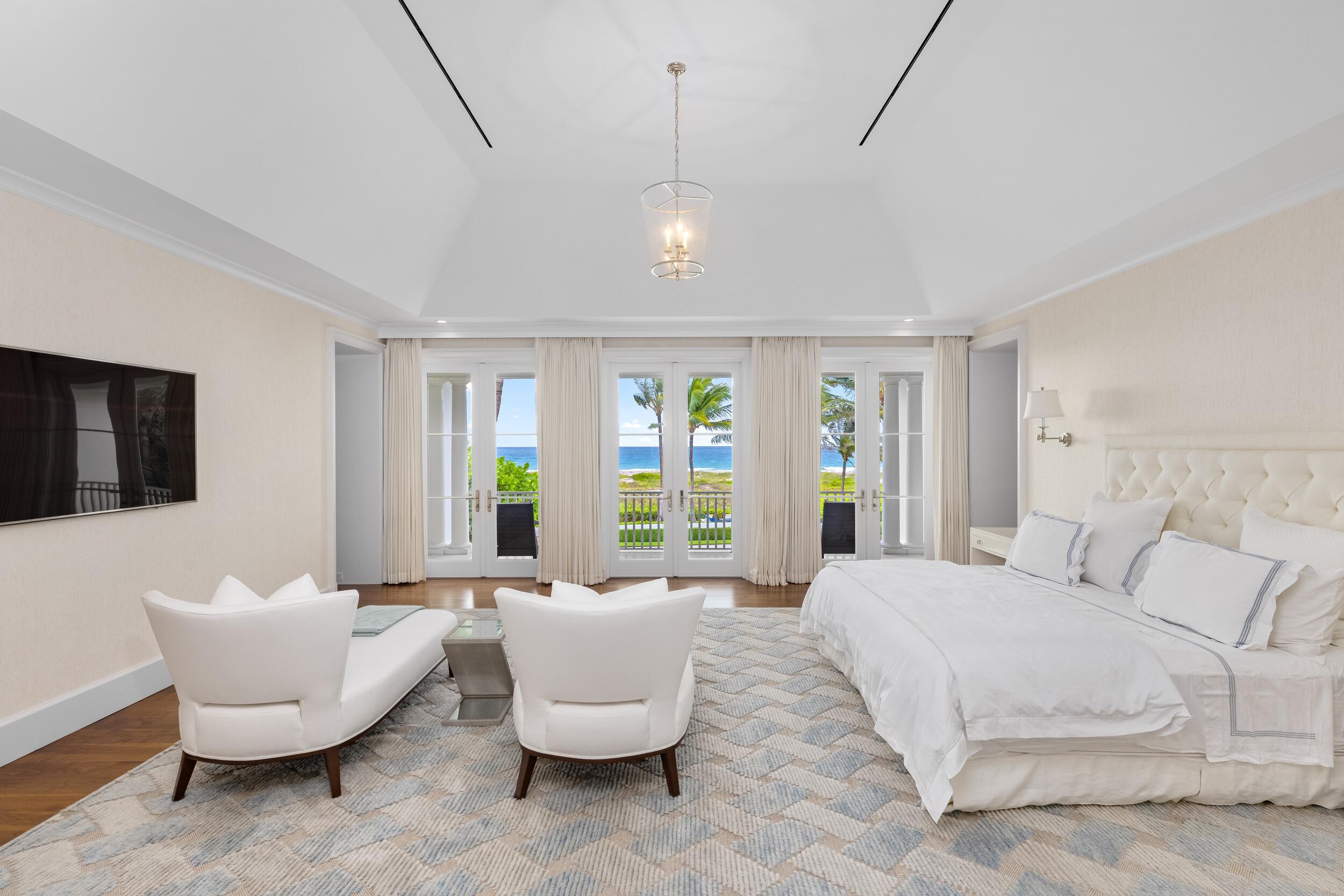 102 Reef Road Palm Beach, FL 33480 - Photo 12 of 22 a spacious bedroom with a bed and a couch