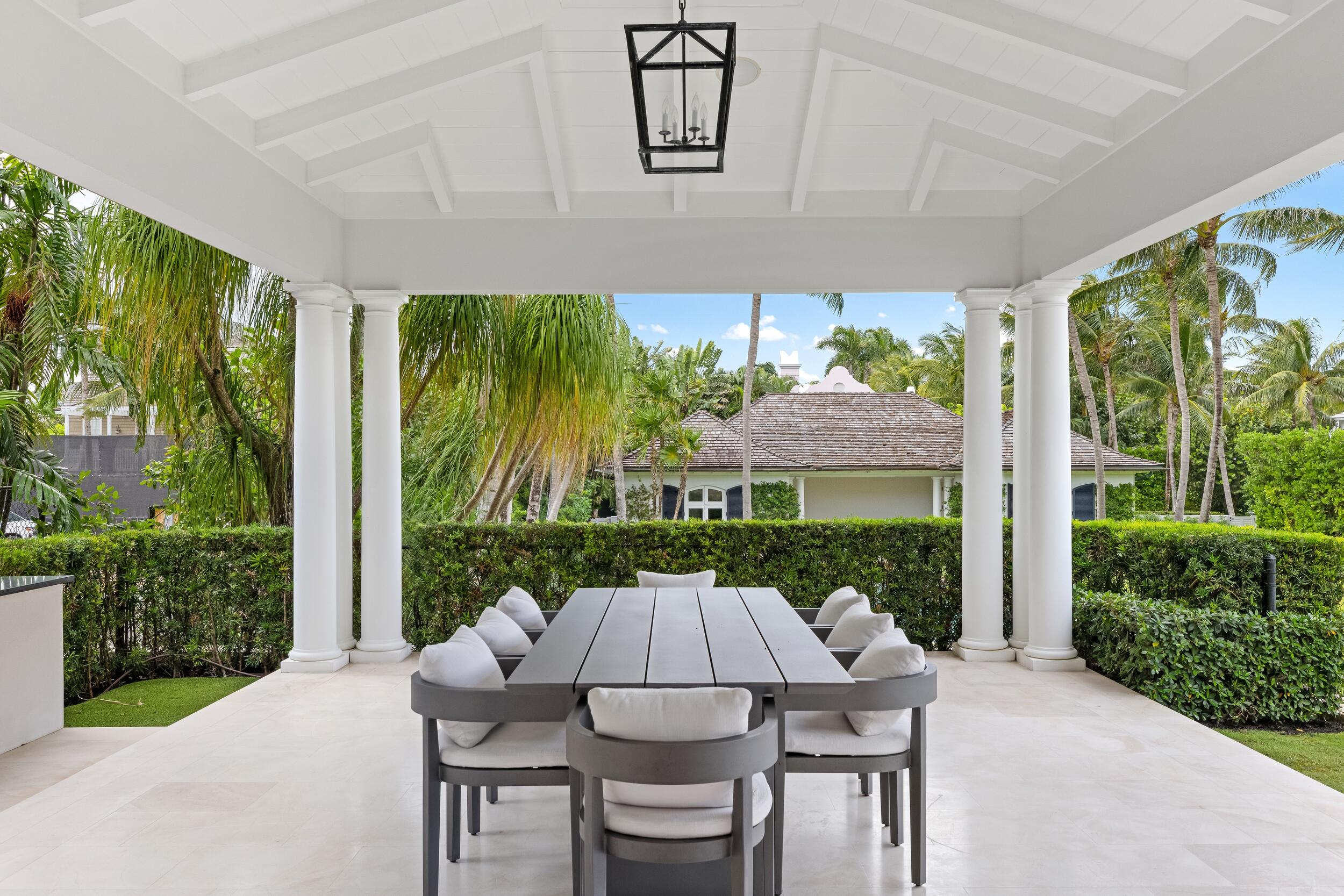 102 Reef Road Palm Beach, FL 33480 - Photo 14 of 22 a patio with table and chairs