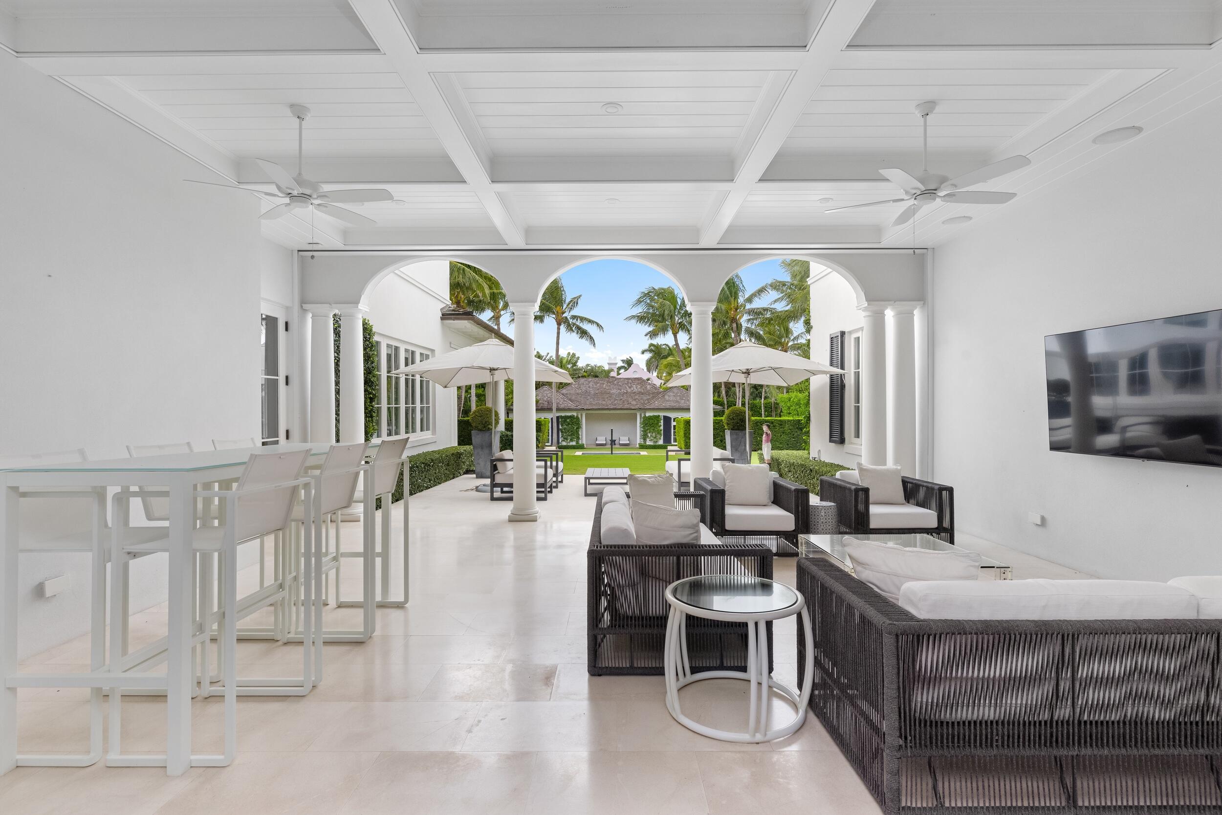 102 Reef Road Palm Beach, FL 33480 - Photo 15 of 22 a large living room with stainless steel appliances furniture and a large window