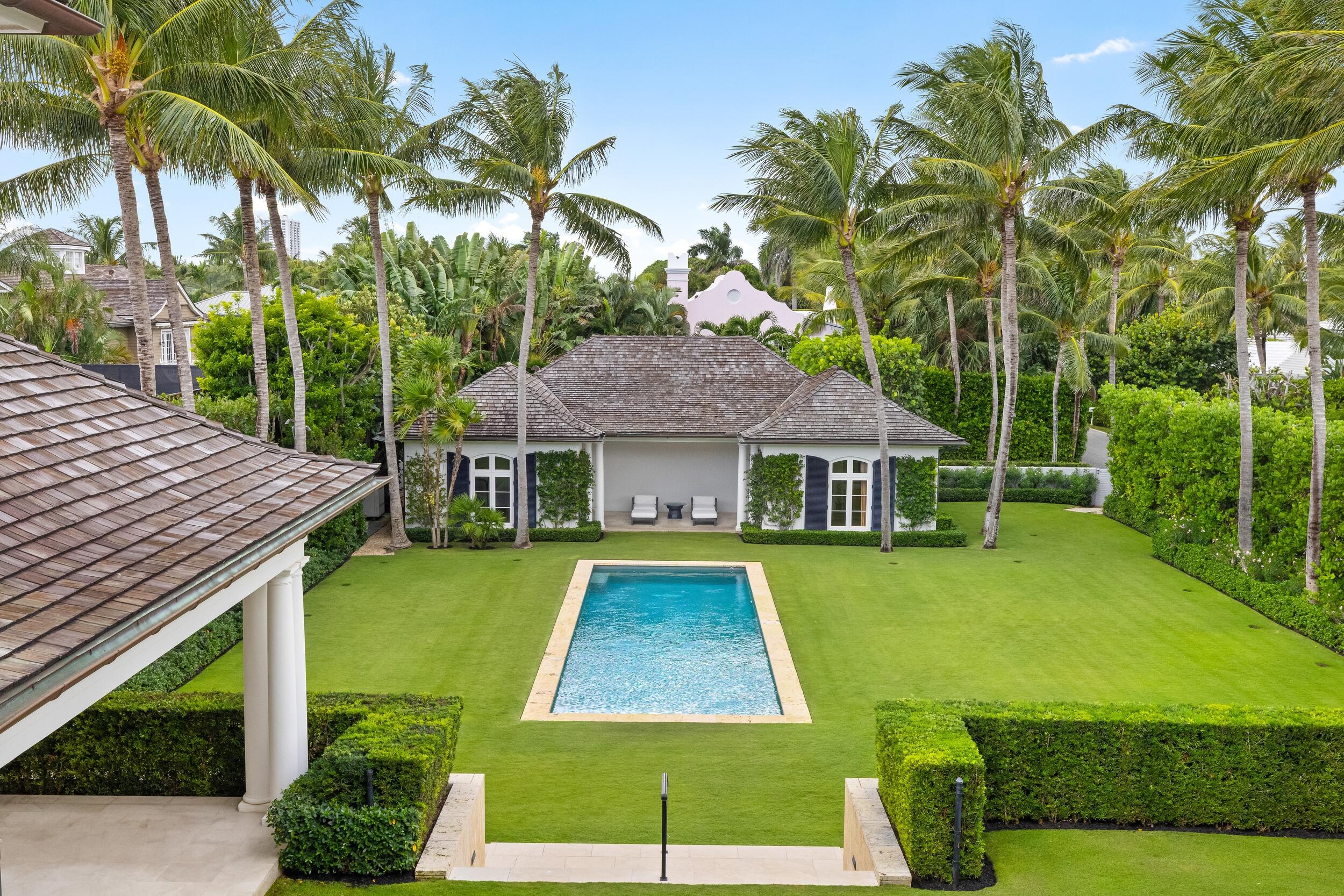 102 Reef Road Palm Beach, FL 33480 - Photo 16 of 22 a front view of a house with garden