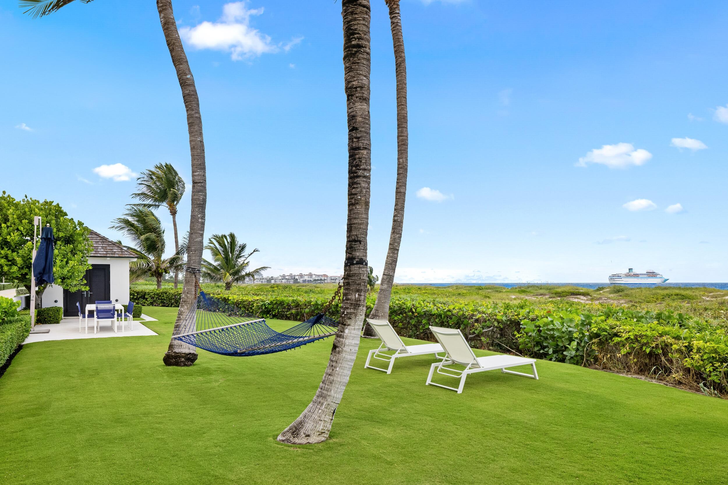 102 Reef Road Palm Beach, FL 33480 - Photo 22 of 22 a view of a garden with slide