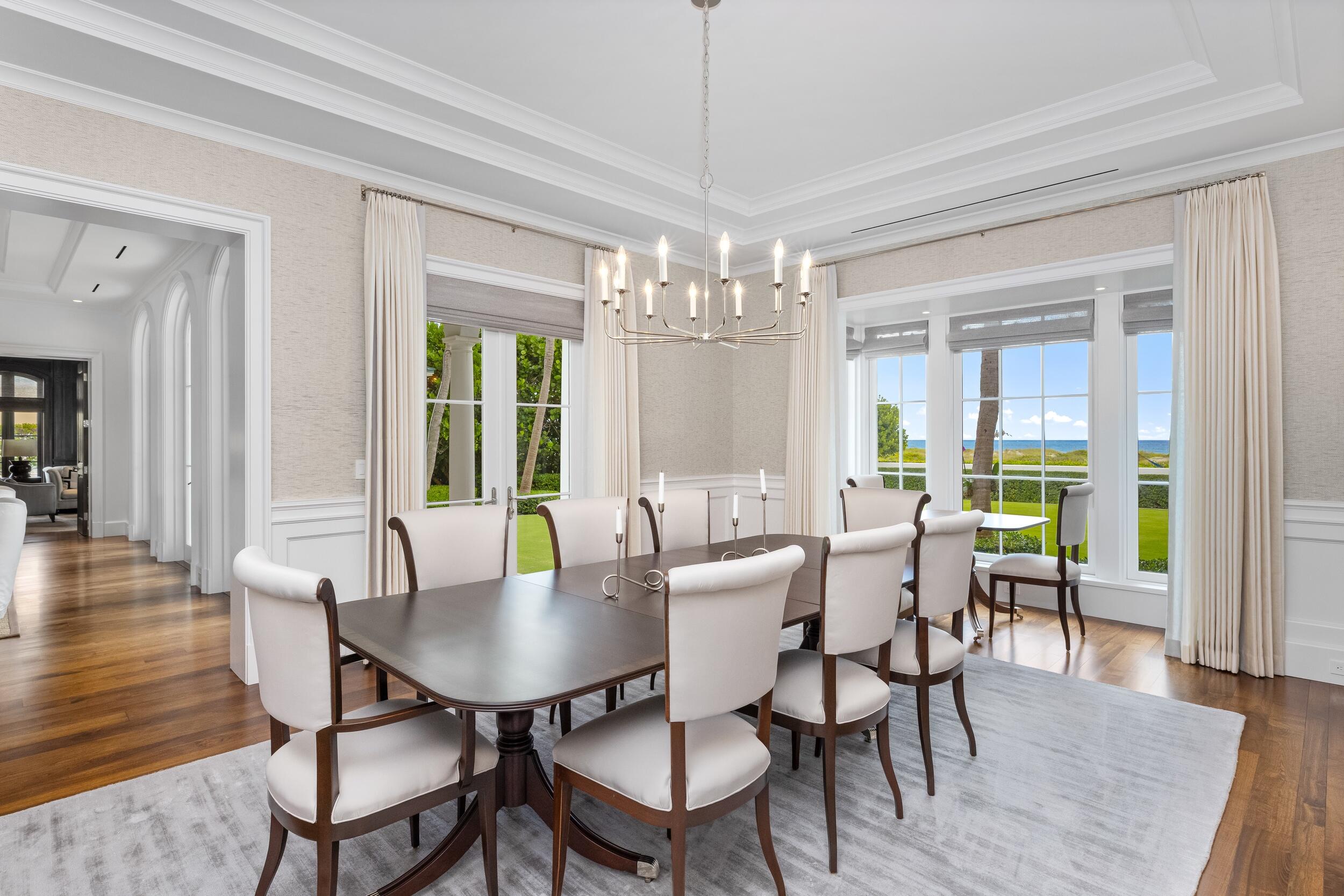 102 Reef Road Palm Beach, FL 33480 - Photo 7 of 22 a view of a dining room with furniture wooden floor and chandelier