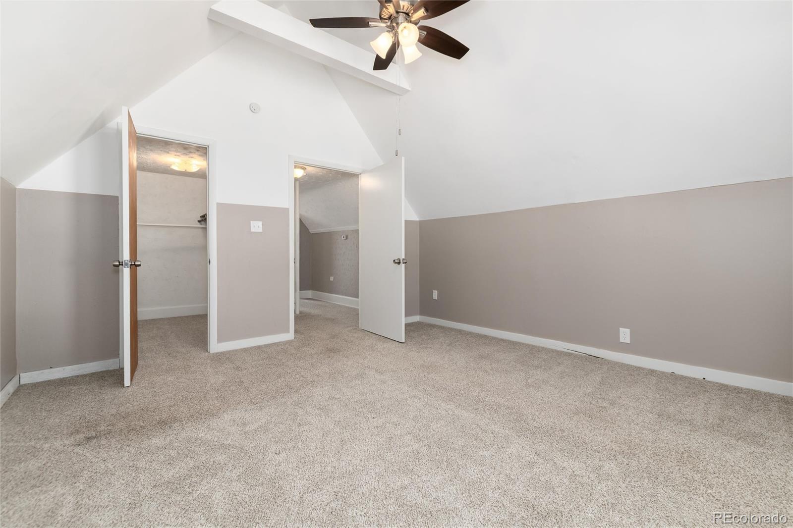 735 Colorado Boulevard Idaho Springs, CO 80452 - Photo 11 of 34 an empty room with chandelier fan