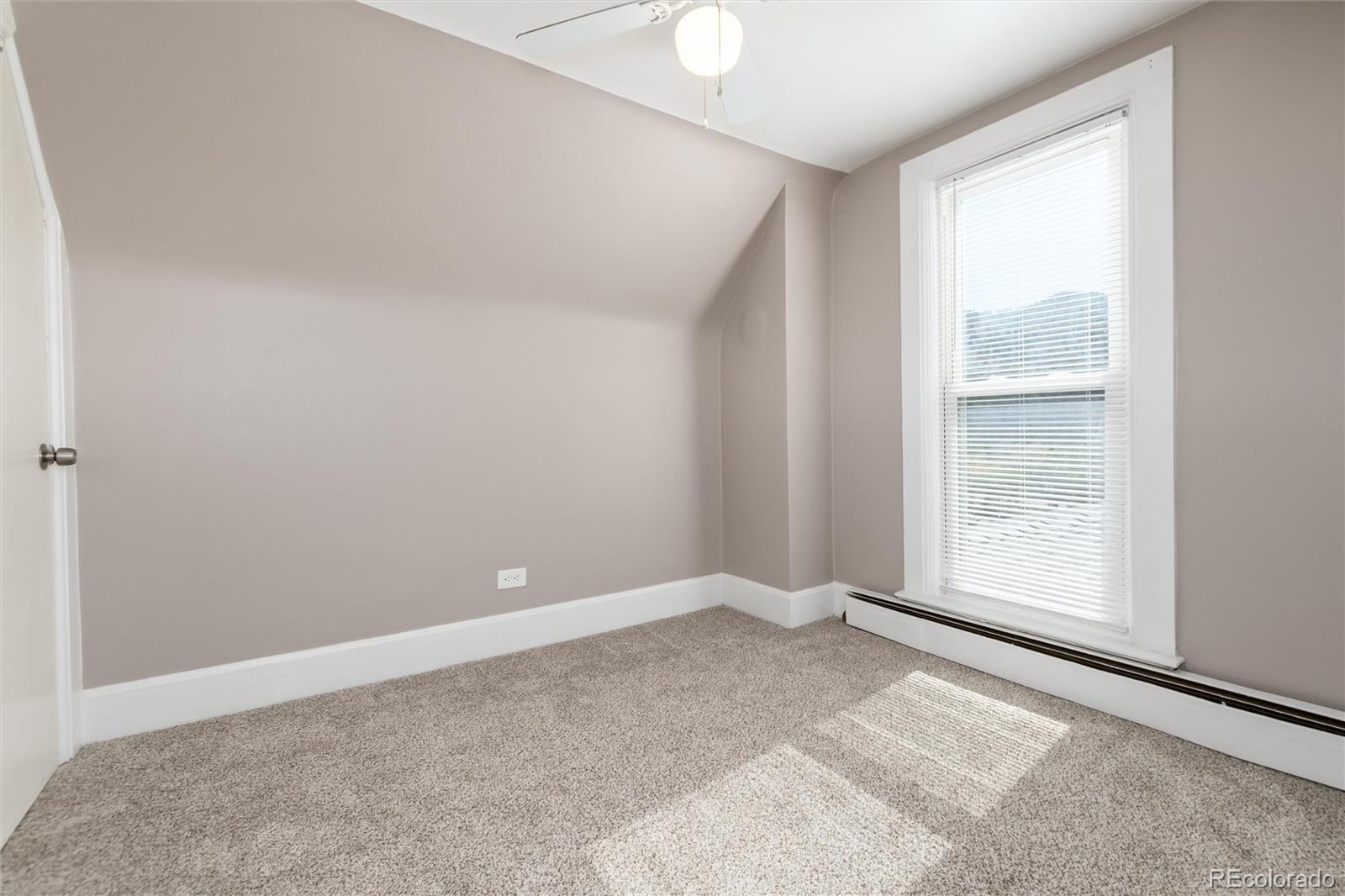 735 Colorado Boulevard Idaho Springs, CO 80452 - Photo 12 of 34 a view of an empty room with a window