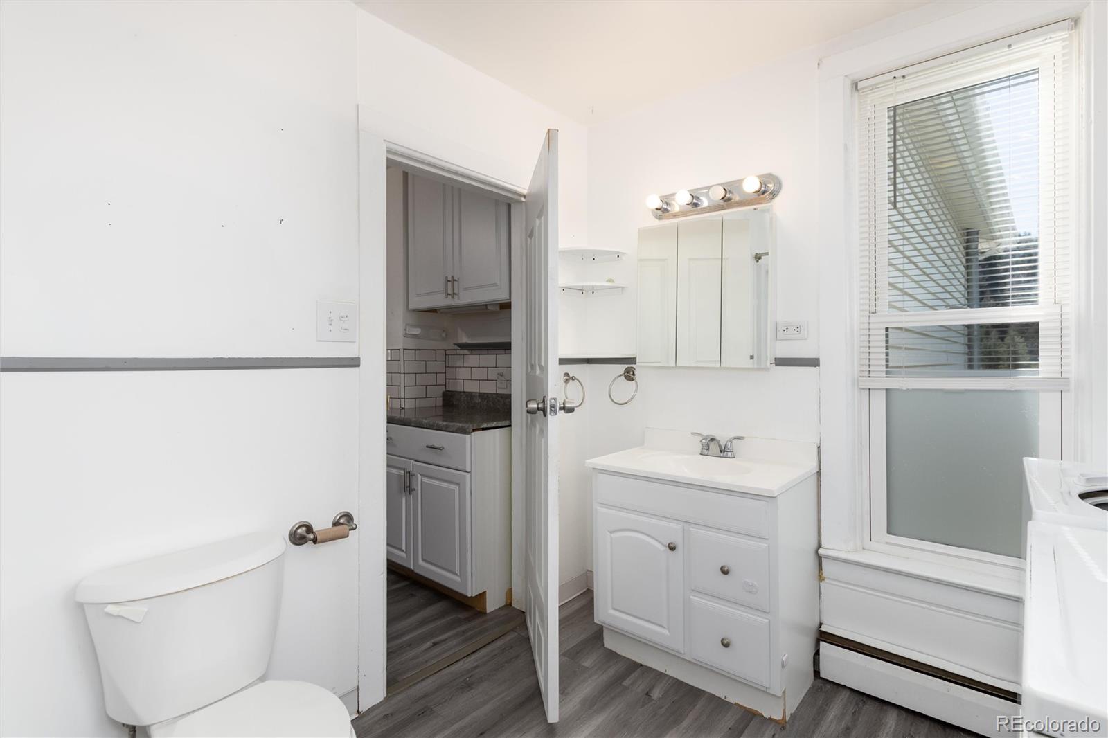 735 Colorado Boulevard Idaho Springs, CO 80452 - Photo 14 of 34 a bathroom with a sink a toilet and shower