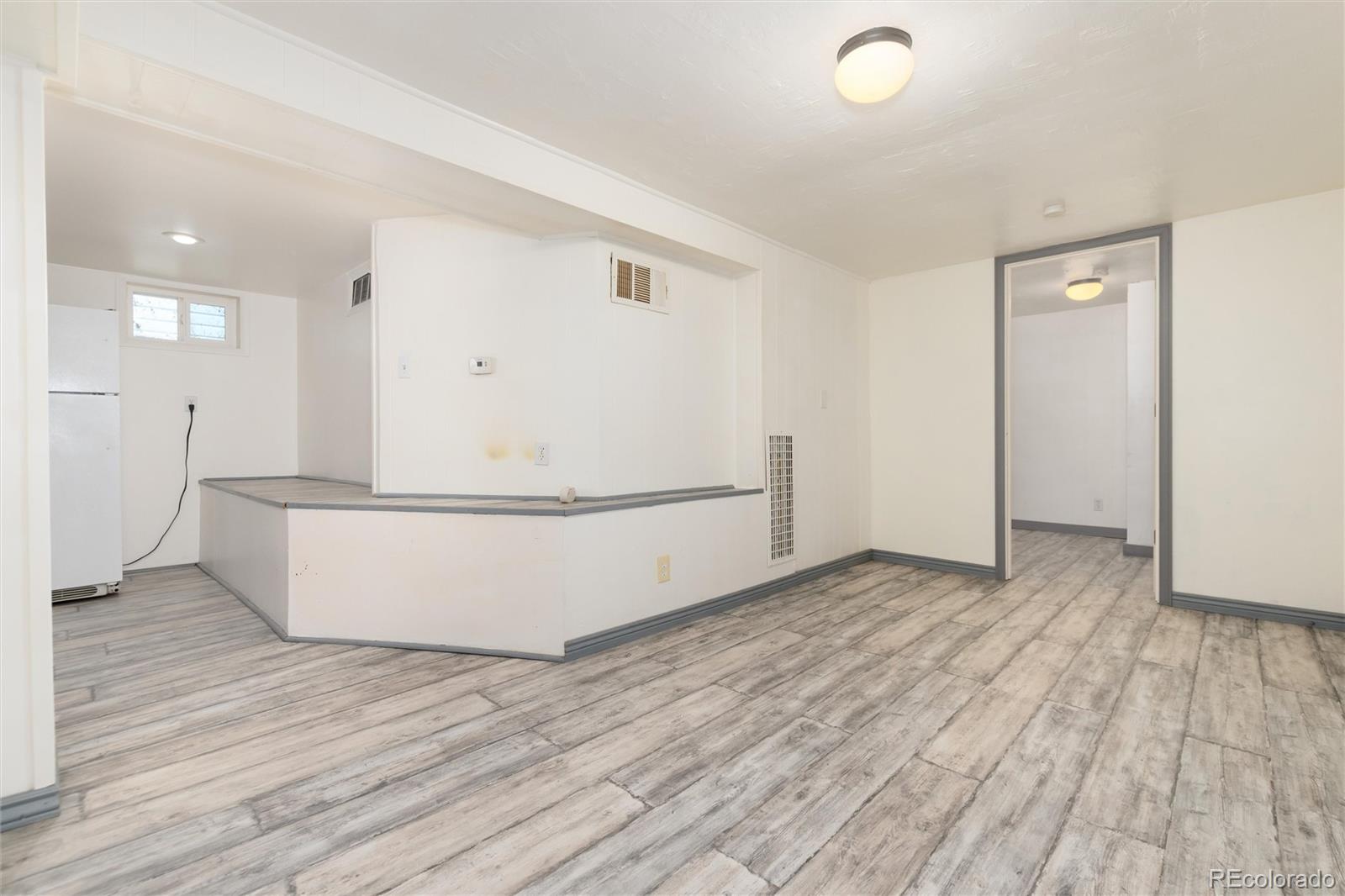 735 Colorado Boulevard Idaho Springs, CO 80452 - Photo 22 of 34 a view of kitchen with stainless steel appliances granite countertop cabinets and wooden floor