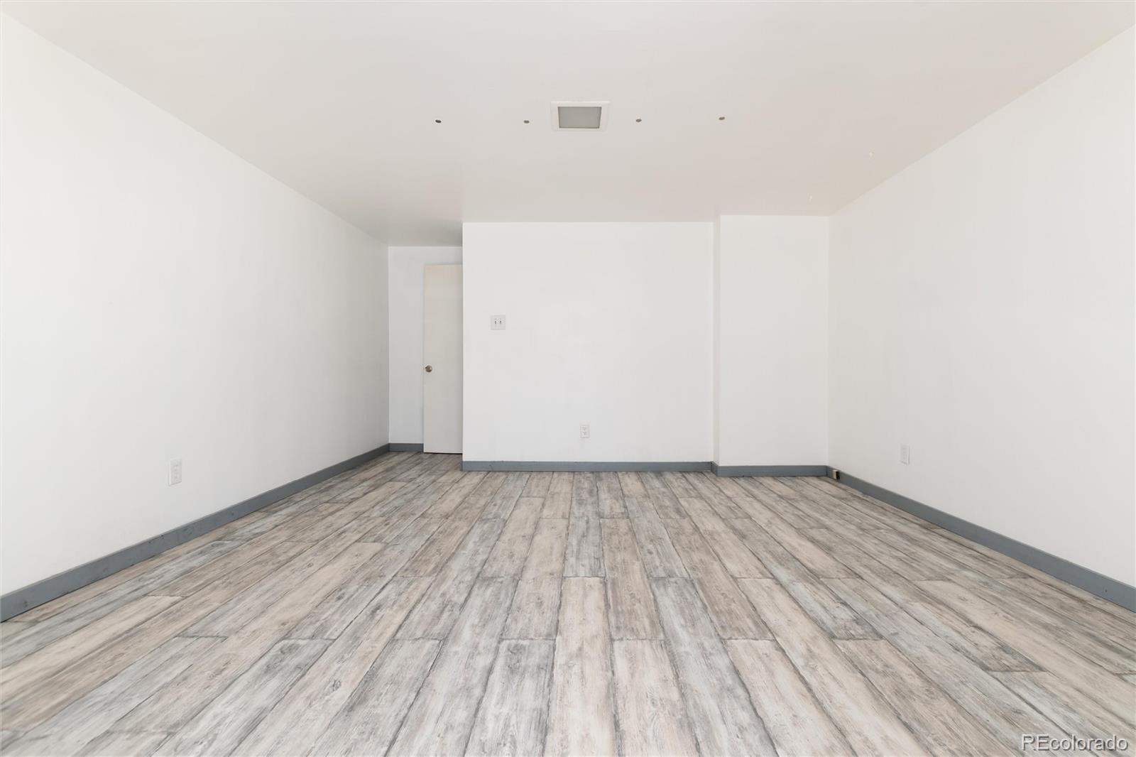 735 Colorado Boulevard Idaho Springs, CO 80452 - Photo 25 of 34 a view of a room with wooden floor