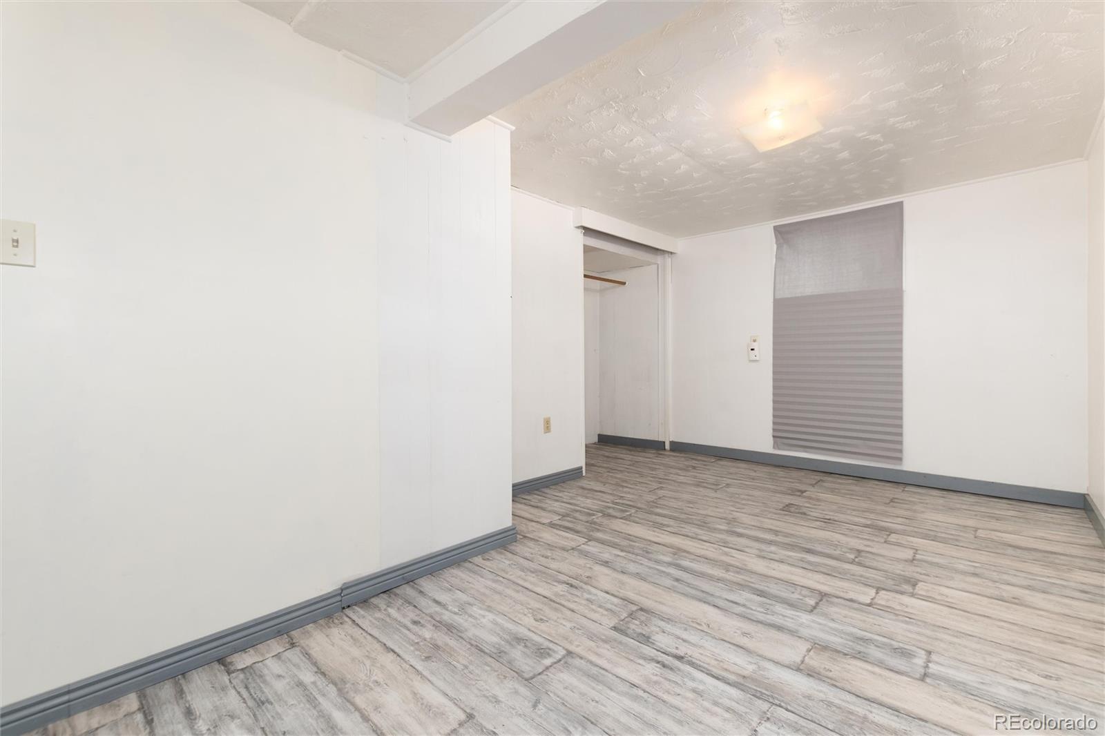 735 Colorado Boulevard Idaho Springs, CO 80452 - Photo 26 of 34 a view of a room with wooden floor