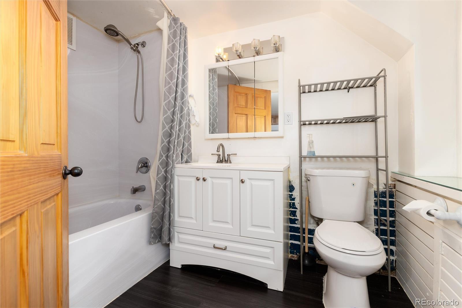 735 Colorado Boulevard Idaho Springs, CO 80452 - Photo 27 of 34 a bathroom with a sink toilet and shower