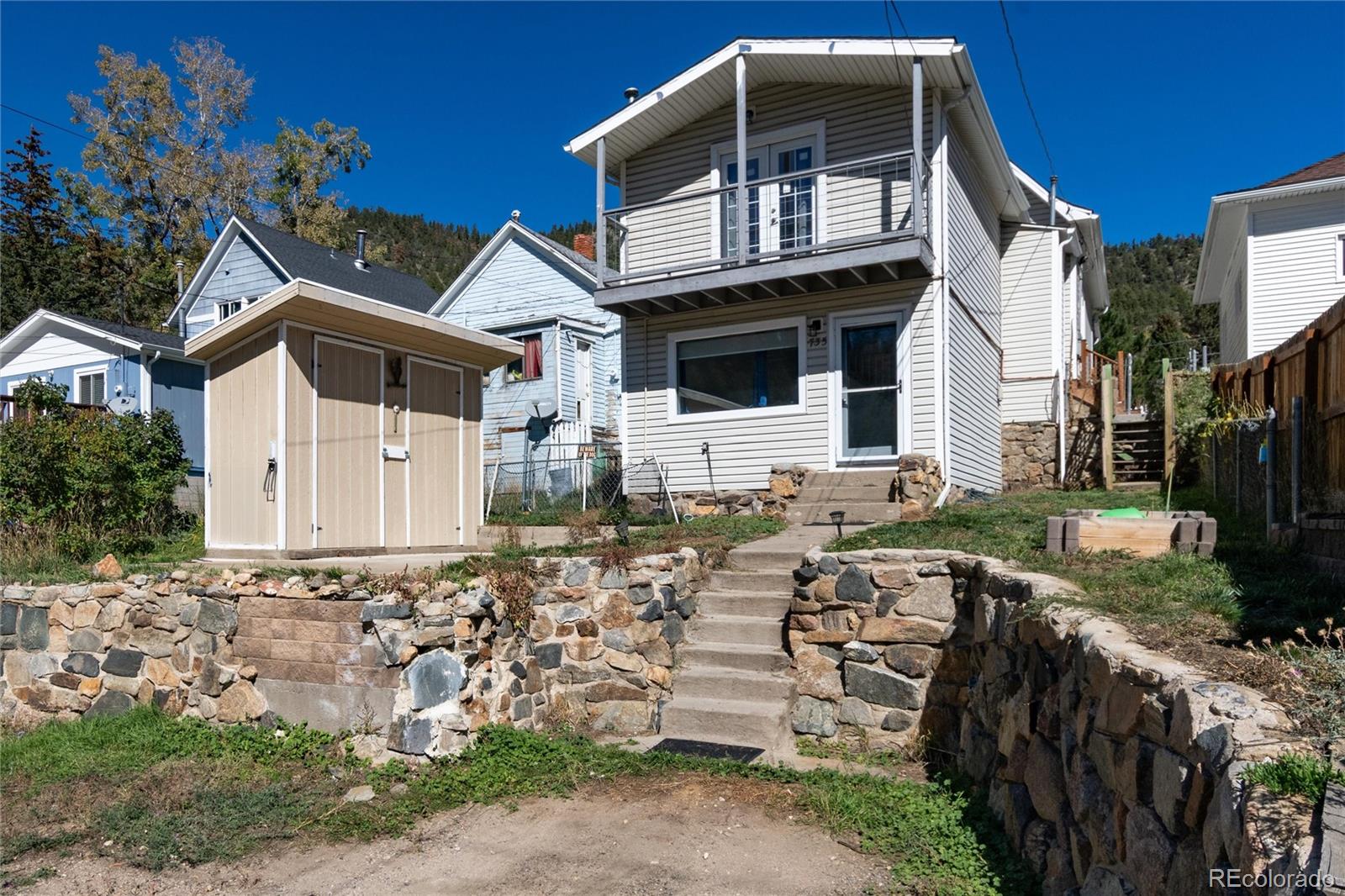 735 Colorado Boulevard Idaho Springs, CO 80452 - Photo 28 of 34 a front view of a house with a yard