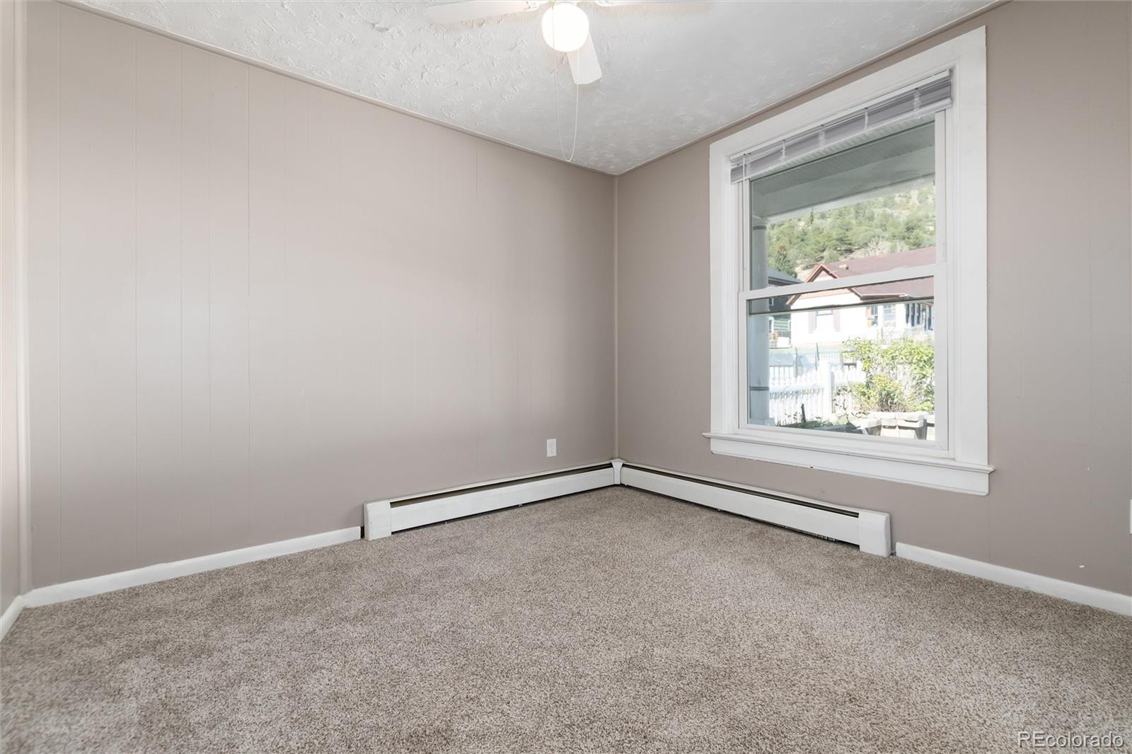 735 Colorado Boulevard Idaho Springs, CO 80452 - Photo 8 of 34 an empty room with a window