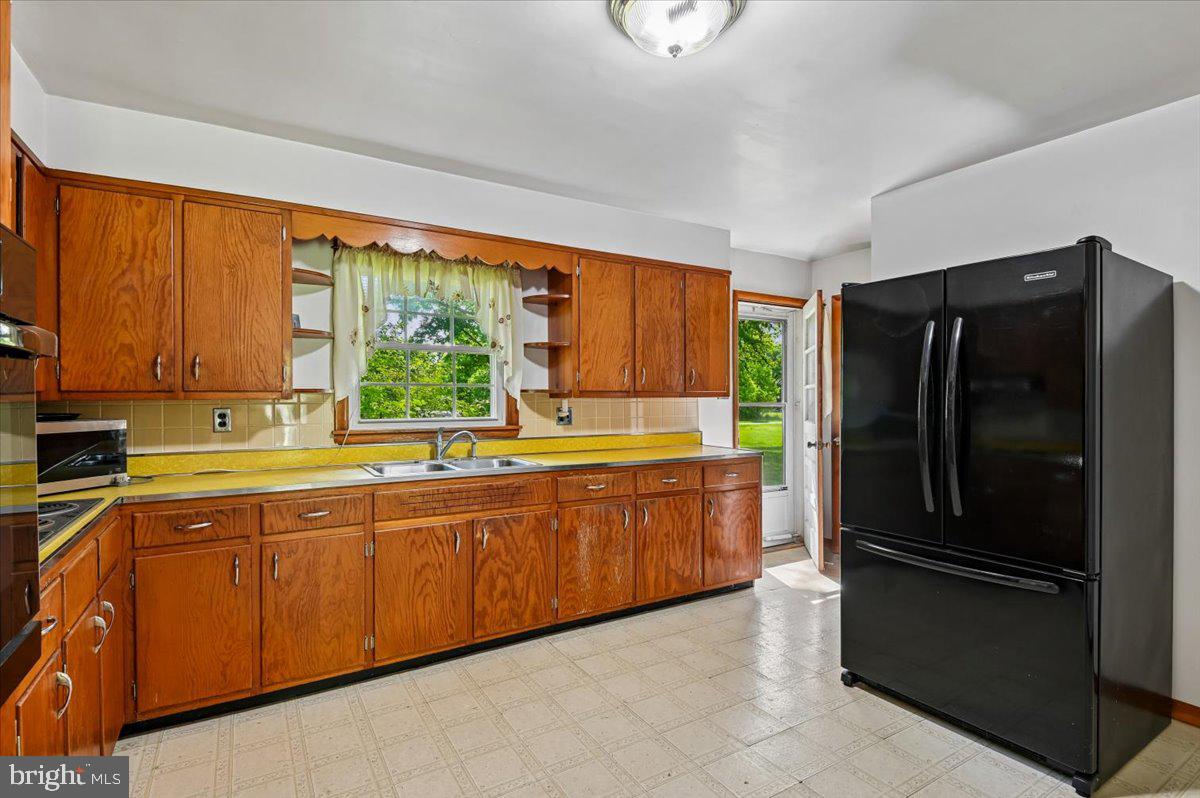 1509 Duvall Road Annapolis, MD 21409 - Photo 24 of 39 a kitchen with stainless steel appliances granite countertop a refrigerator and a sink