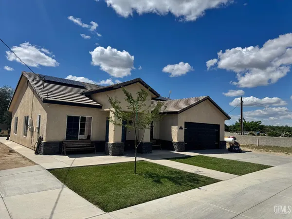 a view of house with yard